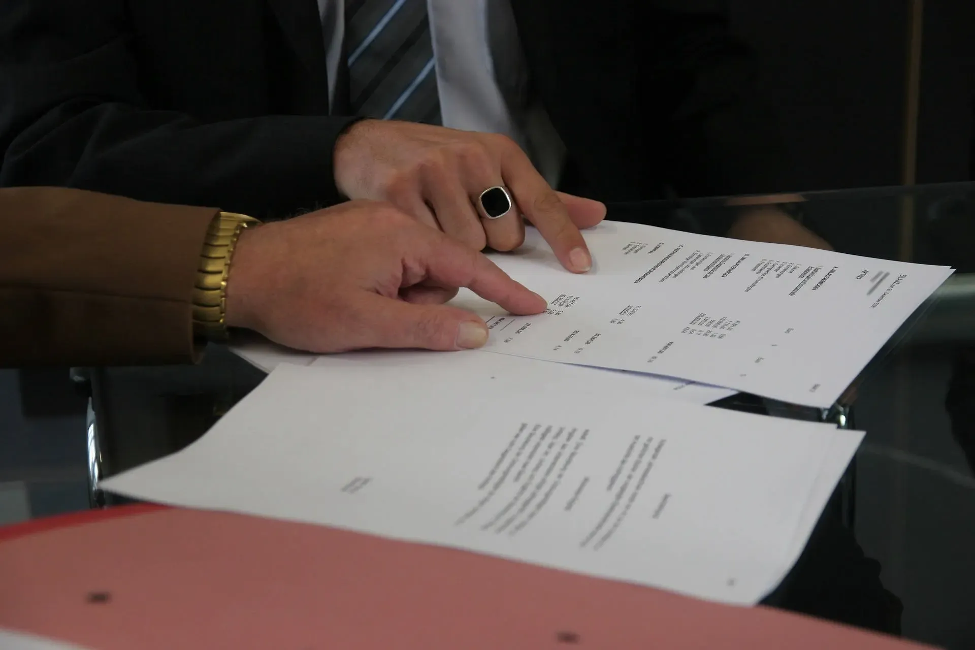 A client reviewing documents across a desk