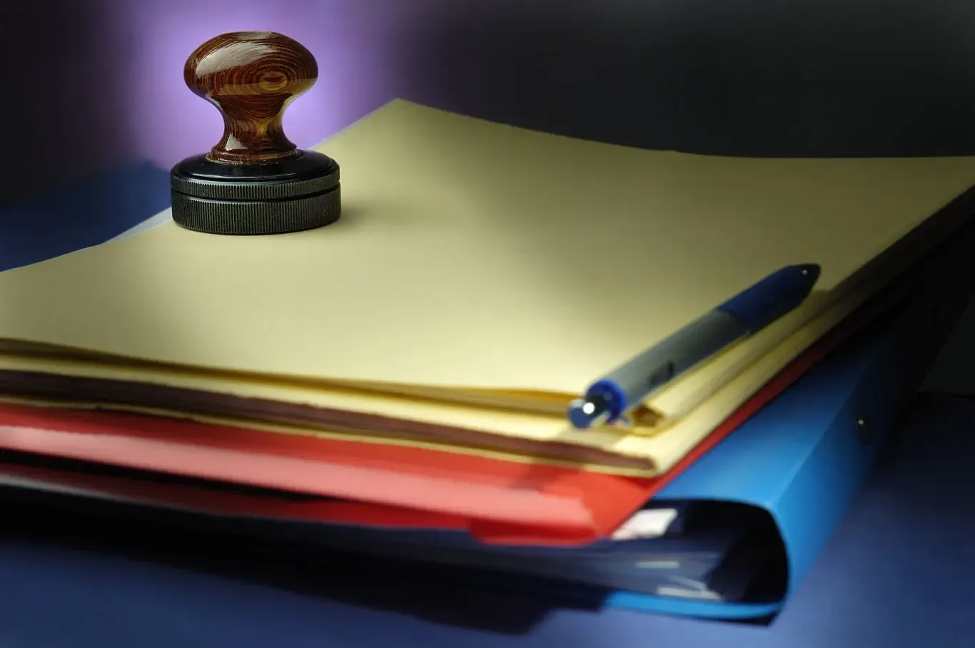 Business records in folders with an office stamp